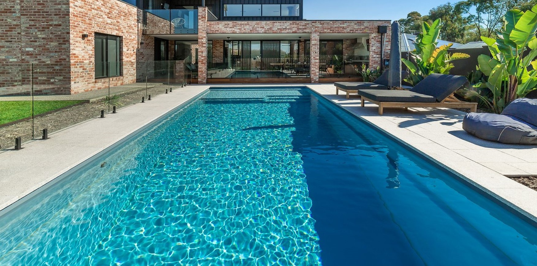 Sunseeker pool beside a modern family home